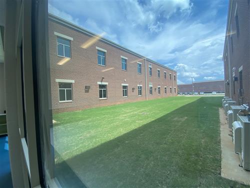 view from classroom looking out on courtyard of school